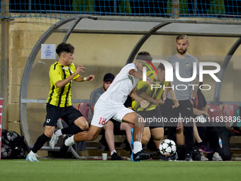 Keyon Ewurum of Valletta vies for the ball with Jouni Hamalainen of Honka during the UEFA Youth League soccer match between Valletta and Hon...