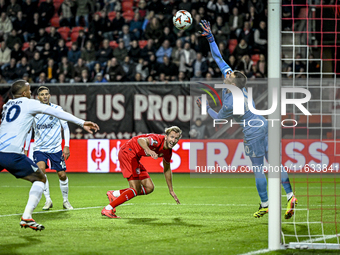 FC Twente midfielder Michel Vlap scores the 1-0 against Fenerbahce goalkeeper Dominik Livakovic during the match between Twente and Fenerbah...