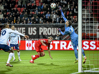 FC Twente midfielder Michel Vlap scores the 1-0 against Fenerbahce goalkeeper Dominik Livakovic during the match between Twente and Fenerbah...