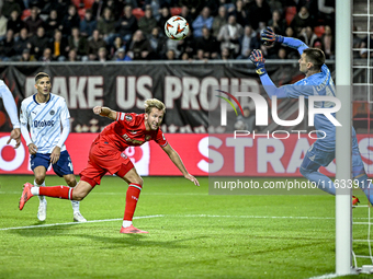 FC Twente midfielder Michel Vlap scores the 1-0 against Fenerbahce goalkeeper Dominik Livakovic during the match between Twente and Fenerbah...