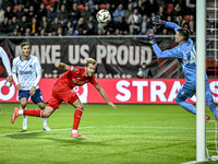 FC Twente midfielder Michel Vlap scores the 1-0 against Fenerbahce goalkeeper Dominik Livakovic during the match between Twente and Fenerbah...