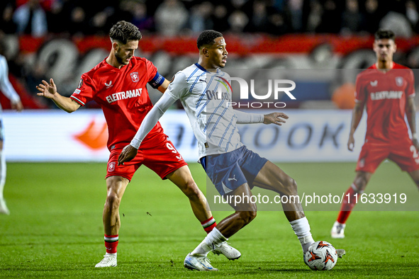 FC Twente forward Ricky van Wolfswinkel and Fenerbahce defender Jayden Oosterwolde play during the match between Twente and Fenerbahce at th...