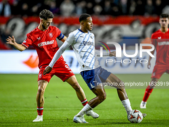 FC Twente forward Ricky van Wolfswinkel and Fenerbahce defender Jayden Oosterwolde play during the match between Twente and Fenerbahce at th...