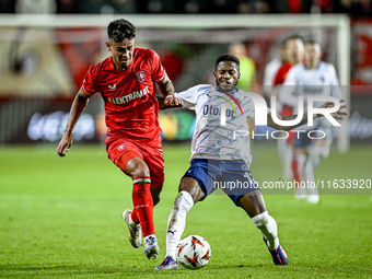 FC Twente defender Mees Hilgers and Fenerbahce midfielder Fred play during the match between Twente and Fenerbahce at the Grolsch Veste for...