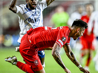 FC Twente defender Mees Hilgers and Fenerbahce midfielder Fred play during the match between Twente and Fenerbahce at the Grolsch Veste for...