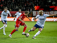 FC Twente midfielder Youri Regeer and Fenerbahce midfielder Sofyan Amrabat play during the match between Twente and Fenerbahce at the Grolsc...