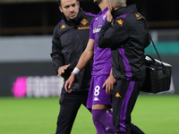 Rolando Mandragora leaves the pitch supported by masseurs during the Conference League match between ACF Fiorentina and The New Saints, on O...