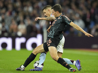 Joao Palhinha defensive midfield of Bayern Munich and Portugal and Lucas Digne left-back of Aston Villa and France compete for the ball duri...