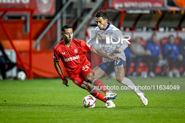 FC Twente defender Anass Salah-Eddine and Fenerbahce midfielder Irfan Can Kahveci play during the match between Twente and Fenerbahce at the...