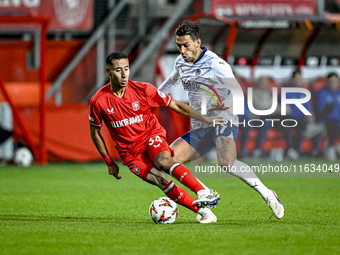 FC Twente defender Anass Salah-Eddine and Fenerbahce midfielder Irfan Can Kahveci play during the match between Twente and Fenerbahce at the...