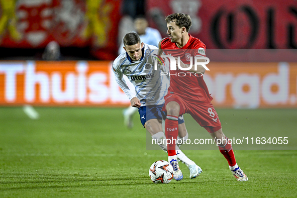 Fenerbahce midfielder Sebastian Szymanski and FC Twente midfielder Youri Regeer play during the match between Twente and Fenerbahce at the G...