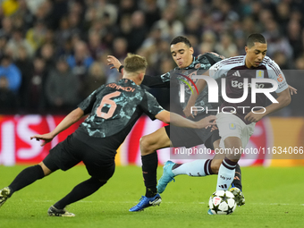 Youri Tielemans central midfield of Aston Villa and Belgium and Jamal Musiala attacking midfield of Bayern Munich and Germany compete for th...