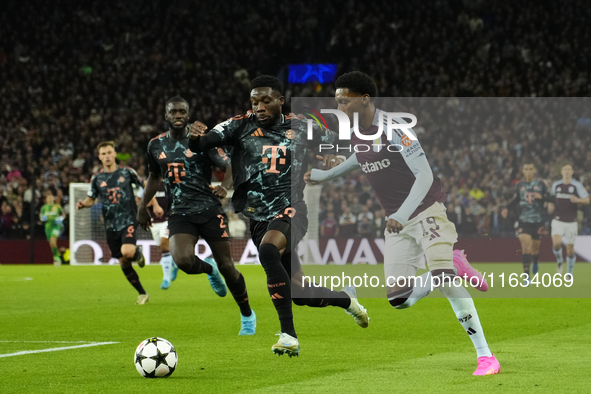 Jaden Philogene left winger of Aston Villa and England and Alphonso Davies left-back of Bayern Munich and Canada compete for the ball during...