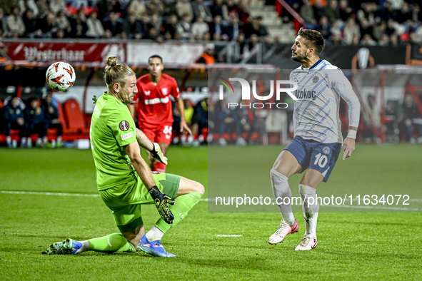 FC Twente goalkeeper Lars Unnerstall and Fenerbahce forward Dusan Tadic score to make it 1-1 during the match between Twente and Fenerbahce...