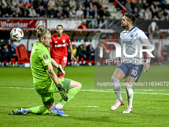 FC Twente goalkeeper Lars Unnerstall and Fenerbahce forward Dusan Tadic score to make it 1-1 during the match between Twente and Fenerbahce...