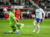 FC Twente goalkeeper Lars Unnerstall and Fenerbahce forward Dusan Tadic score to make it 1-1 during the match between Twente and Fenerbahce...