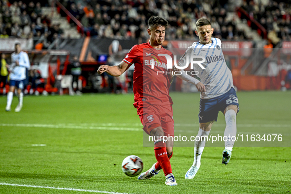 FC Twente defender Mees Hilgers and Fenerbahce midfielder Sebastian Szymanski play during the match between Twente and Fenerbahce at the Gro...