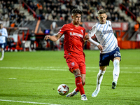 FC Twente defender Mees Hilgers and Fenerbahce midfielder Sebastian Szymanski play during the match between Twente and Fenerbahce at the Gro...