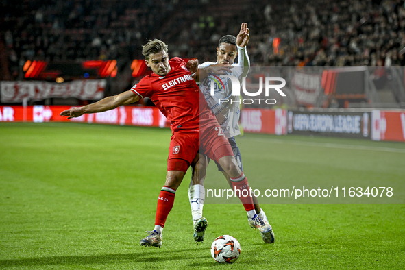 FC Twente defender Bart van Rooij and Fenerbahce defender Jayden Oosterwolde play during the match between Twente and Fenerbahce at the Grol...