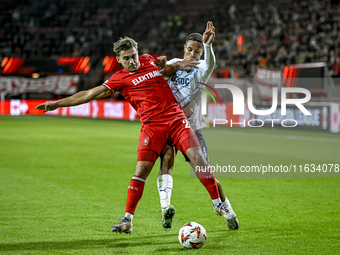 FC Twente defender Bart van Rooij and Fenerbahce defender Jayden Oosterwolde play during the match between Twente and Fenerbahce at the Grol...