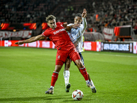 FC Twente defender Bart van Rooij and Fenerbahce defender Jayden Oosterwolde play during the match between Twente and Fenerbahce at the Grol...