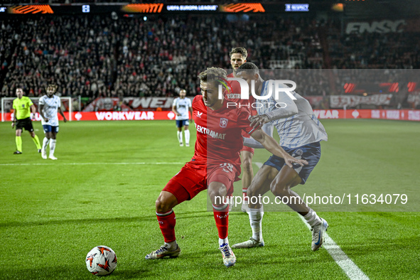 FC Twente defender Bart van Rooij and Fenerbahce defender Jayden Oosterwolde play during the match between Twente and Fenerbahce at the Grol...