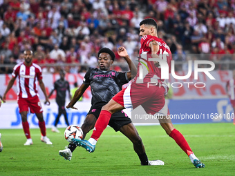 Jean-Baptiste Gorby of SC Braga competes with David Carmo of Olympiacos FC during the Europa League, Matchday 2 match between Olympiacos FC...