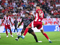 Jean-Baptiste Gorby of SC Braga competes with David Carmo of Olympiacos FC during the Europa League, Matchday 2 match between Olympiacos FC...