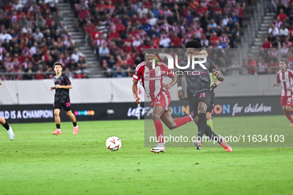 Ayoub El Kaabi of Olympiacos FC competes with Bright Arrey-Mbi of SC Braga during the Europa League, Matchday 2 match between Olympiacos FC...