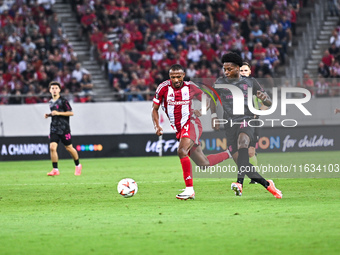 Ayoub El Kaabi of Olympiacos FC competes with Bright Arrey-Mbi of SC Braga during the Europa League, Matchday 2 match between Olympiacos FC...