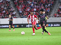 Ayoub El Kaabi of Olympiacos FC competes with Bright Arrey-Mbi of SC Braga during the Europa League, Matchday 2 match between Olympiacos FC...