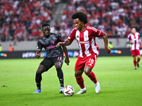 Willian of Olympiacos FC competes with Roger Fernandes of SC Braga during the Europa League, Matchday 2 match between Olympiacos FC and SC B...