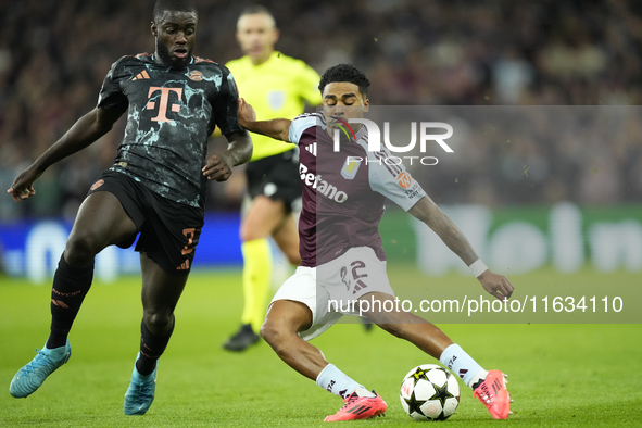 Ian Maatsen left-back of Aston Villa and Netherlands shooting to goal front Dayot Upamecano centre-back of Bayern Munich and France during t...