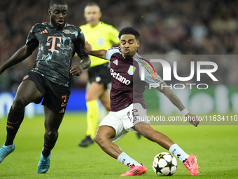 Ian Maatsen left-back of Aston Villa and Netherlands shooting to goal front Dayot Upamecano centre-back of Bayern Munich and France during t...