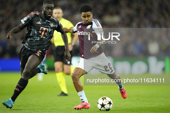 Ian Maatsen left-back of Aston Villa and Netherlands shooting to goal front Dayot Upamecano centre-back of Bayern Munich and France during t...