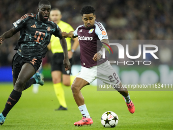 Ian Maatsen left-back of Aston Villa and Netherlands shooting to goal front Dayot Upamecano centre-back of Bayern Munich and France during t...