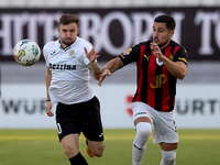 In Ta' Qali, Malta, on October 2, 2024, Jurgen Degabriele of Hibernians is closely challenged by Juan Carlos Corbalan of Hamrun Spartans dur...