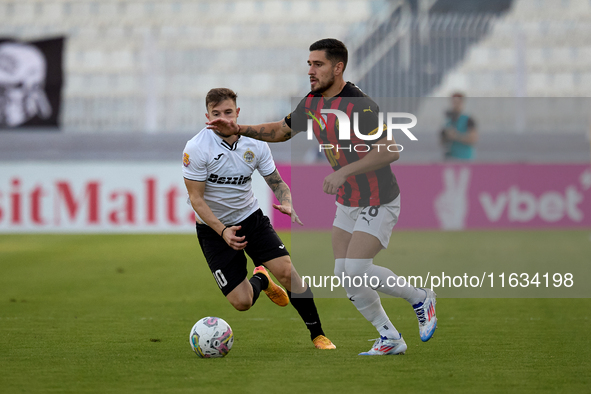 In Ta' Qali, Malta, on October 2, 2024, Jurgen Degabriele of Hibernians follows Juan Carlos Corbalan of Hamrun Spartans during the Malta 360...