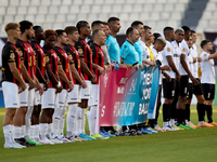 Soccer players from Hamrun Spartans and Floriana stand with the match officials to hold a Marigold Foundation ''Pink October'' Movember camp...