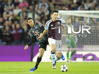 Pau Torres centre-back of Aston Villa and Spain and Jamal Musiala attacking midfield of Bayern Munich and Germany compete for the ball durin...