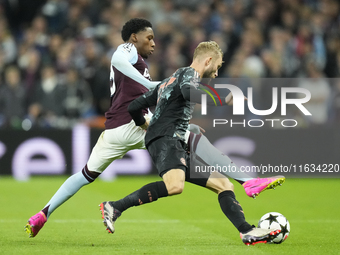 Konrad Laimer central midfield of Bayern Munich and Austria and Jaden Philogene left winger of Aston Villa and England compete for the ball...