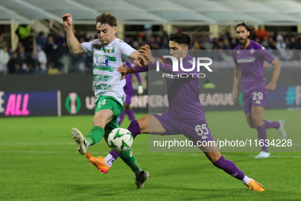 Fabiano Parisi of ACF Fiorentina and Matthew Olosunde of The New Saints ,battle for the ball during  the Conference League match between ACF...