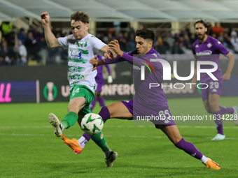 Fabiano Parisi of ACF Fiorentina and Matthew Olosunde of The New Saints ,battle for the ball during  the Conference League match between ACF...