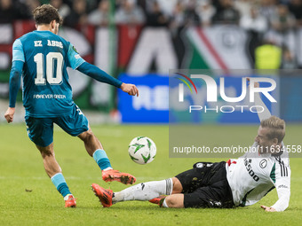 Abdessamad Ezzalzouli , Rafal Augustyniak  during UEFA Conference League match Legia Warsaw vs Real Betis in Warsaw Poland on 3 October 2024...