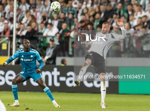 Nobel Mendy , Tomas Pekhart  during UEFA Conference League match Legia Warsaw vs Real Betis in Warsaw Poland on 3 October 2024. 