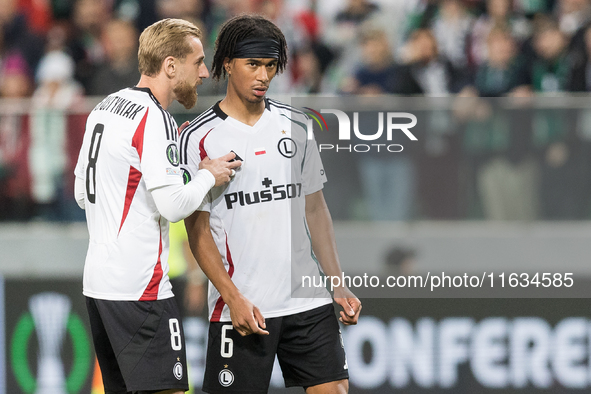 Rafal Augustyniak , Maxi Oyedele  during UEFA Conference League match Legia Warsaw vs Real Betis in Warsaw Poland on 3 October 2024. 