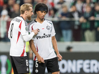 Rafal Augustyniak , Maxi Oyedele  during UEFA Conference League match Legia Warsaw vs Real Betis in Warsaw Poland on 3 October 2024. (