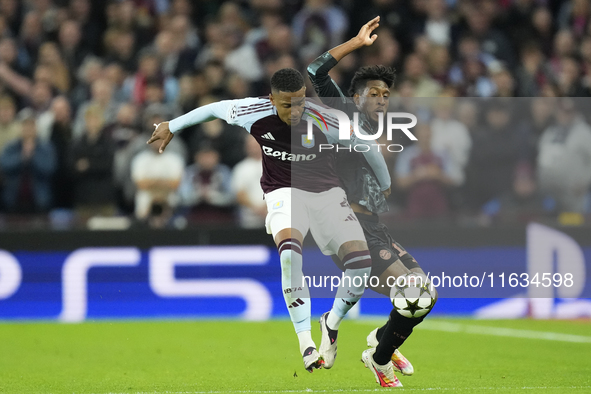 Ezri Konsa centre-back of Aston Villa and England and Kingsley Coman left winger of Bayern Munich and France compete for the ball during the...