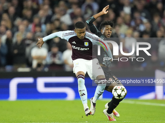 Ezri Konsa centre-back of Aston Villa and England and Kingsley Coman left winger of Bayern Munich and France compete for the ball during the...