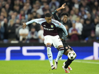 Ezri Konsa centre-back of Aston Villa and England and Kingsley Coman left winger of Bayern Munich and France compete for the ball during the...